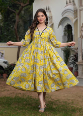 Printed Yellow Anarkali Dress with Puffy Sleeves and Flowing Design
