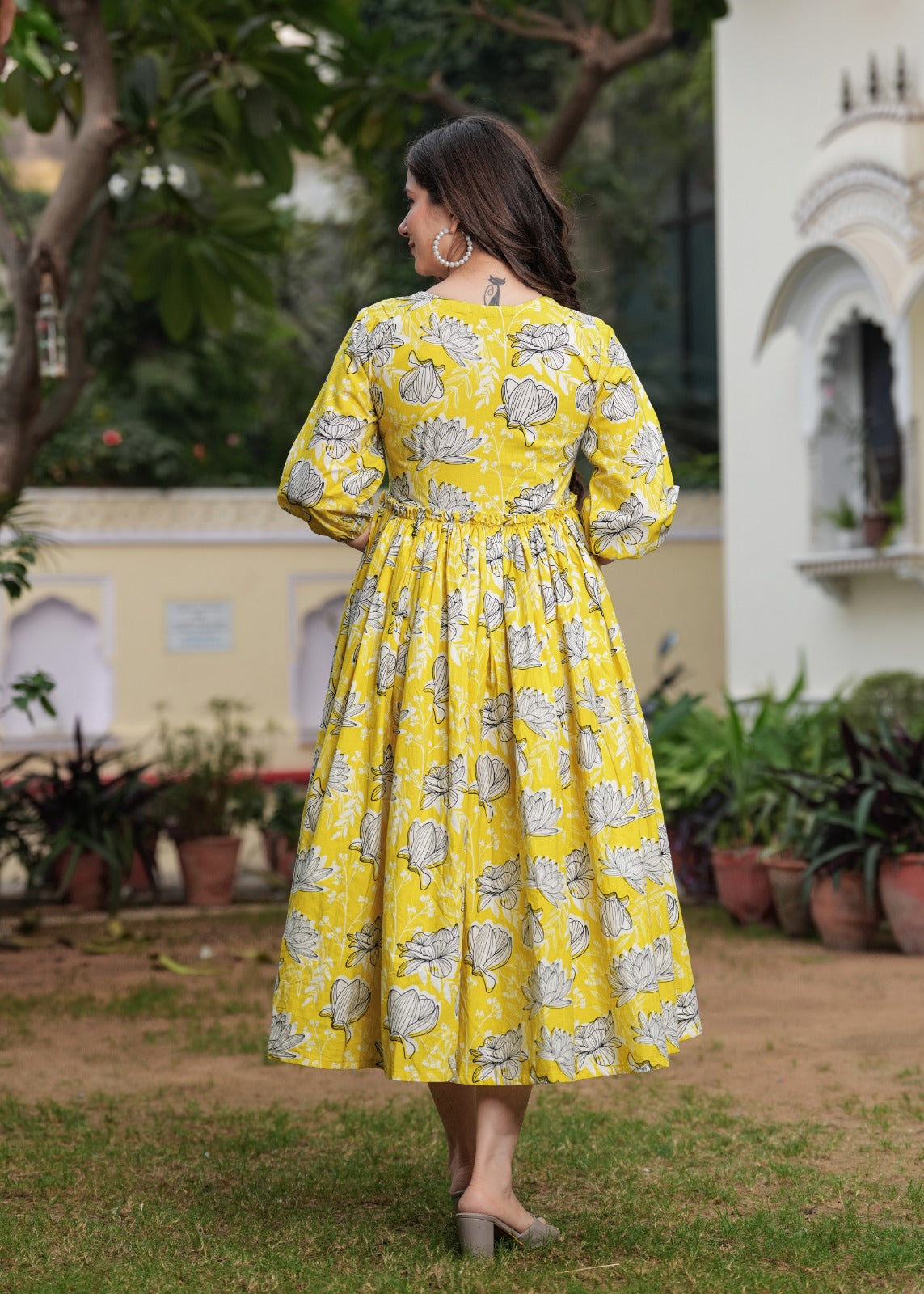 Printed Yellow Anarkali Dress with Puffy Sleeves and Flowing Design