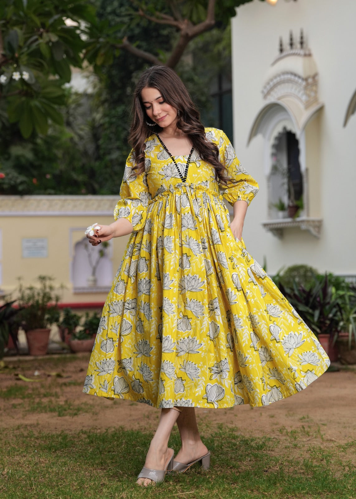 Printed Yellow Anarkali Dress with Puffy Sleeves and Flowing Design