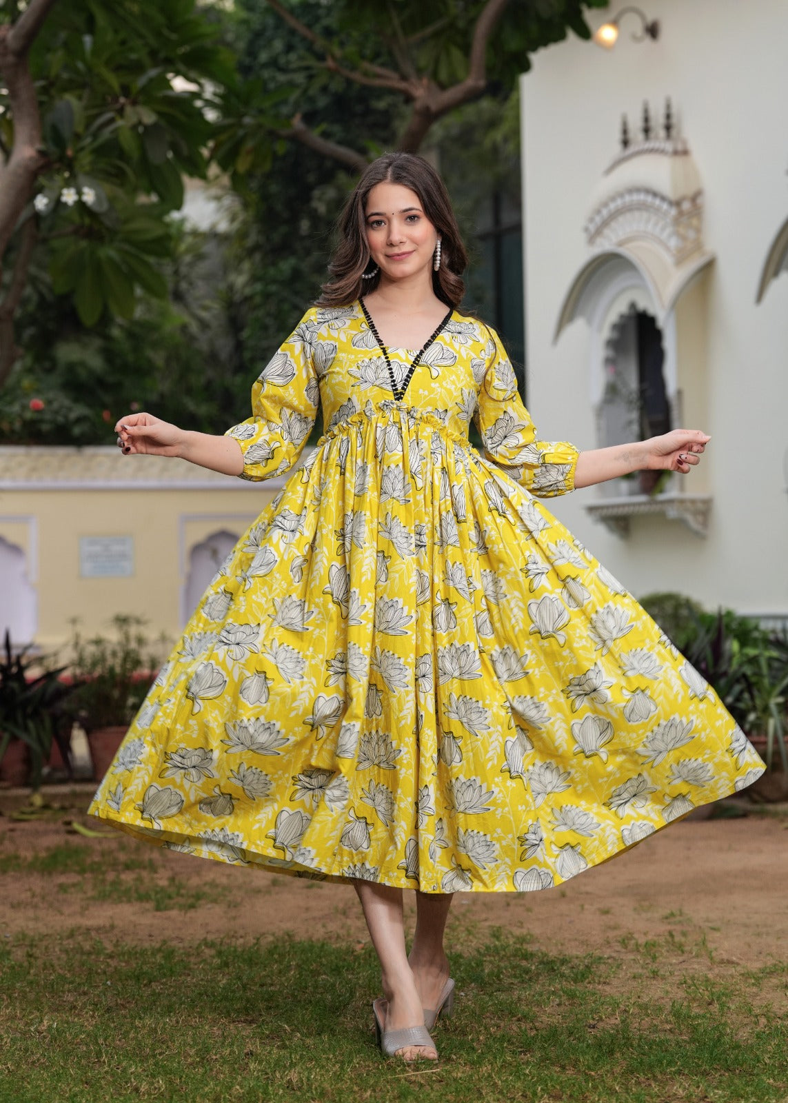 Printed Yellow Anarkali Dress with Puffy Sleeves and Flowing Design