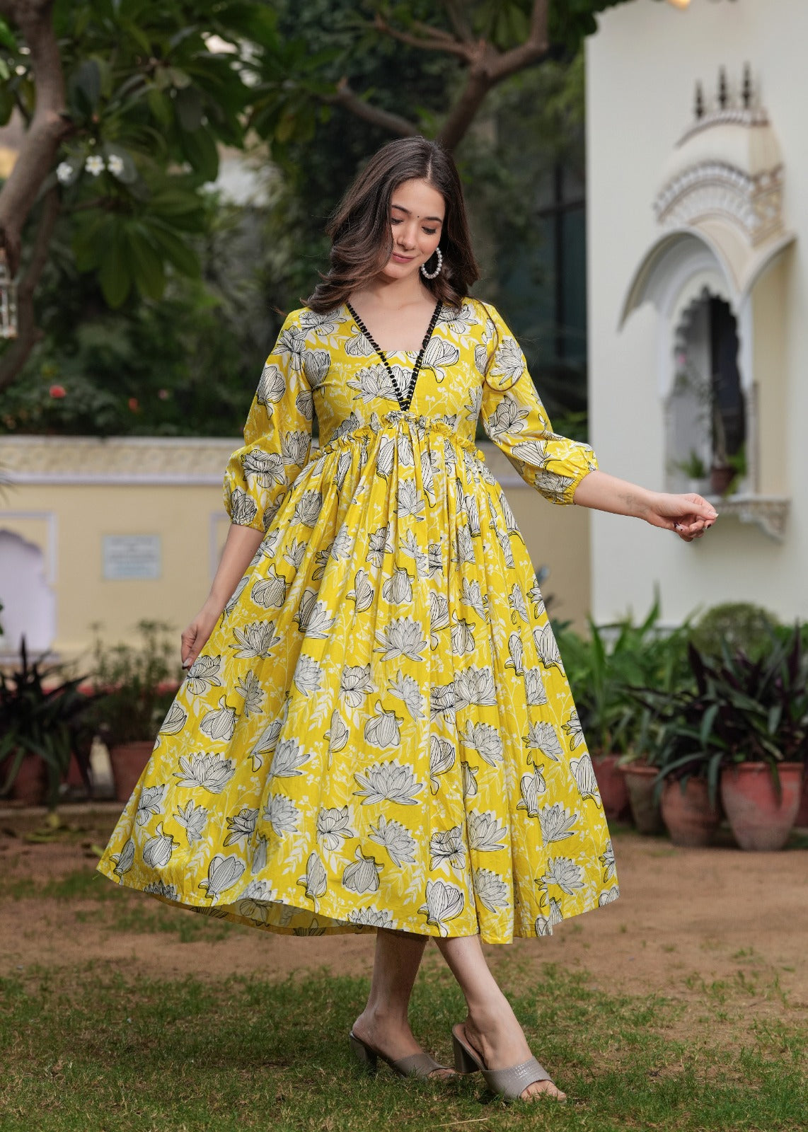 Printed Yellow Anarkali Dress with Puffy Sleeves and Flowing Design