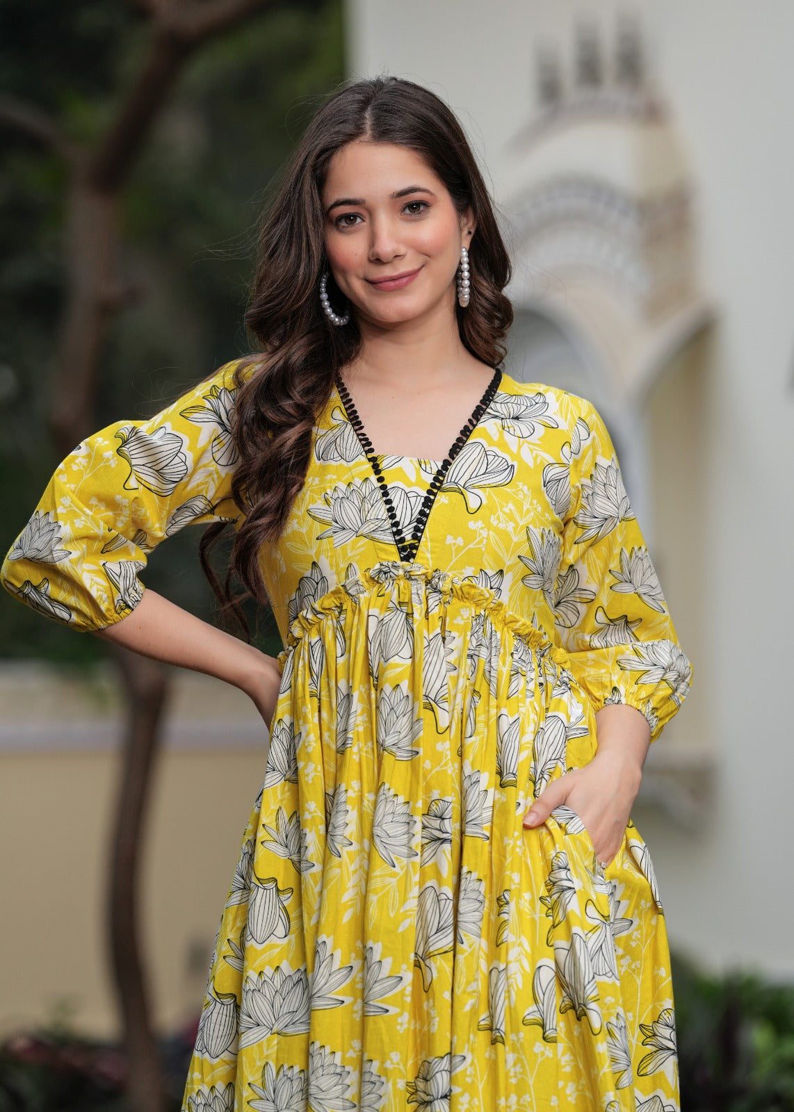 Printed Yellow Anarkali Dress with Puffy Sleeves and Flowing Design